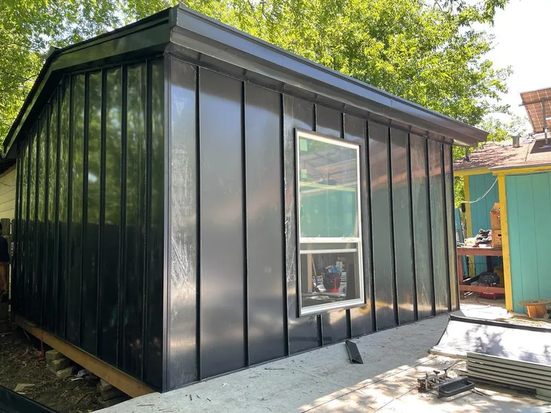 Black standing seam metal wall panels for Roof Inspection in Flagler Beach