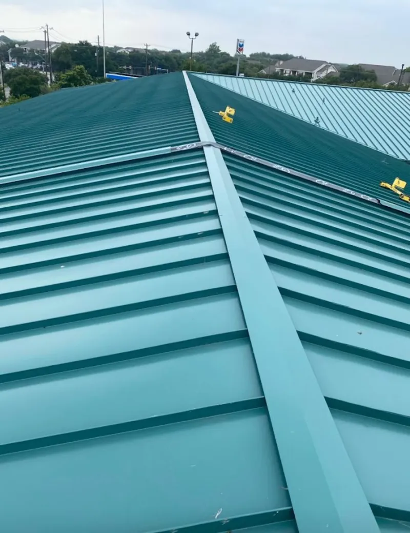 Green commercial metal roof ridge and valley for Metal Roof Repair in Flagler Beach
